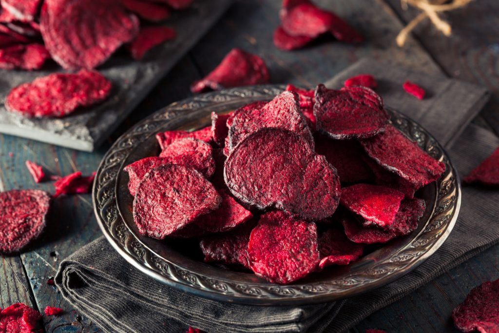 57751440 - healthy purple baked beet chips with sea salt